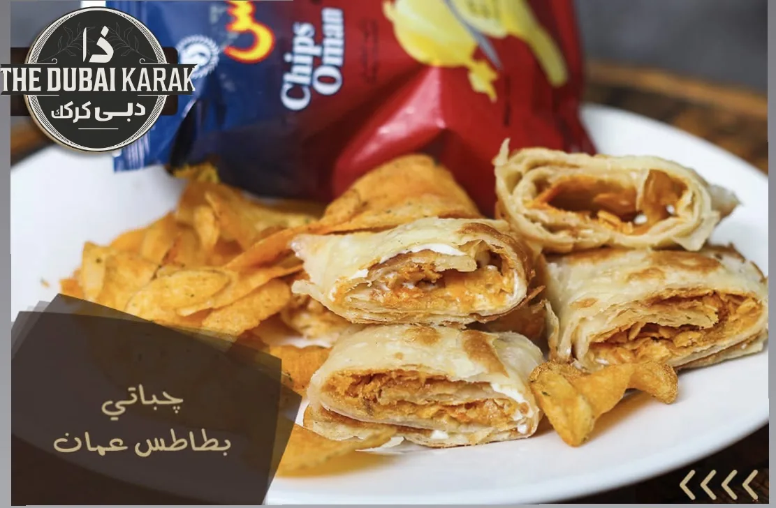 Chips Oman and cheese paratha wraps stacked on a serving plate