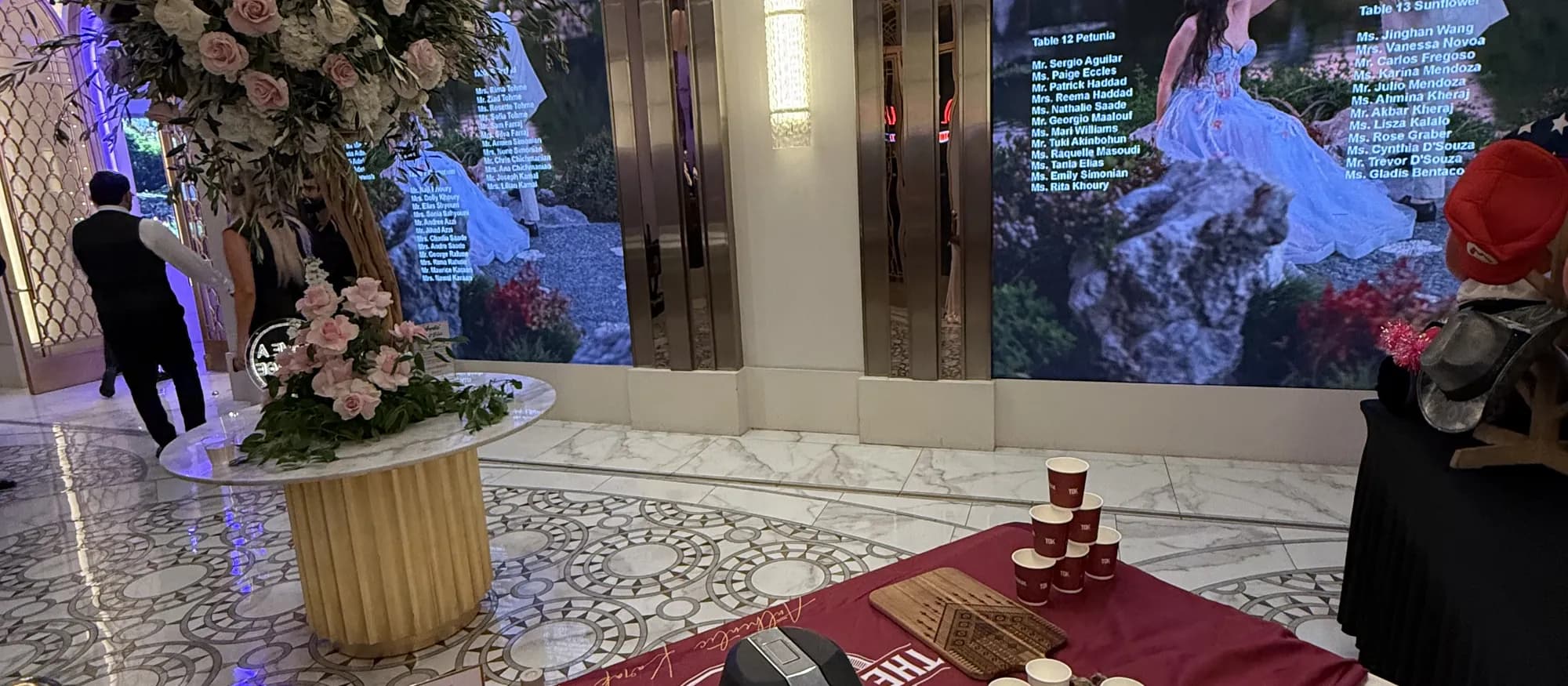 The Dubai Karak tea and coffee station set up beside floral arrangements at an upscale wedding venue